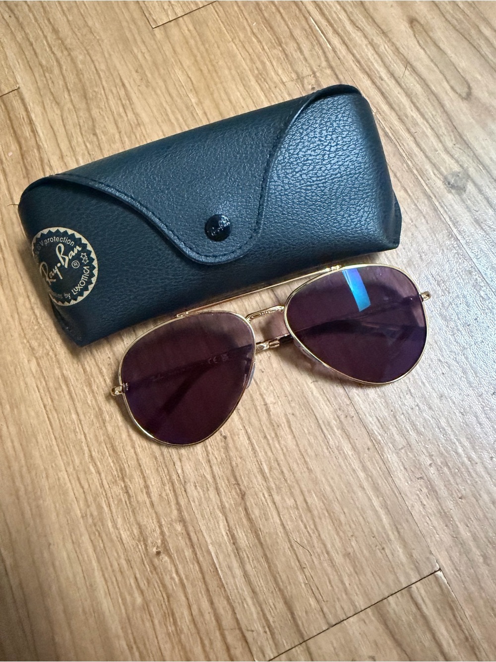 Ray-Ban Women’s Gold Frame Sunglasses with Dark Purple Lenses